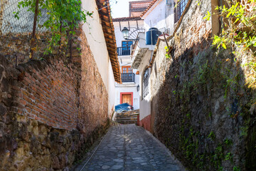 Wall Mural - Mexico, Scenic colorful Taxco cobblestone streets in historic city center.