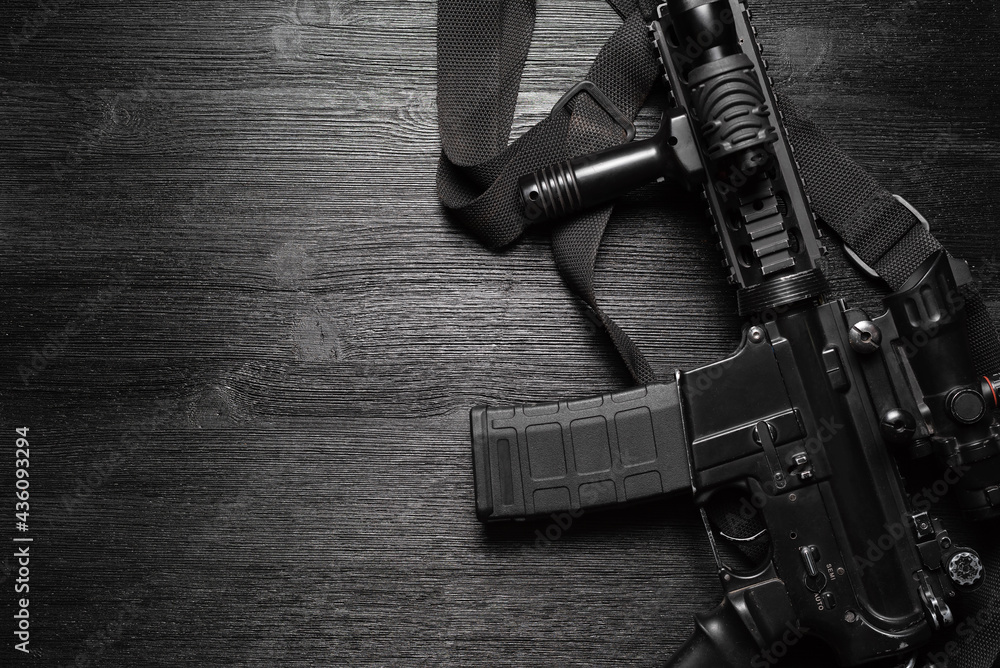 Airsoft rifle on the black flat lay background. Stock Photo | Adobe Stock