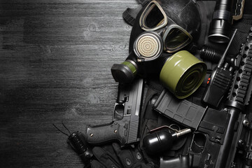 Wall Mural - Airsoft equipment on the black flat lay background with copy space.