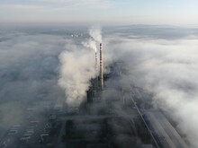 Smoke From A Factory Chimney Above Inversion Cloud Layer