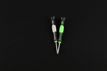 Canvas Print - Closeup of colorful screwdrivers on a black background