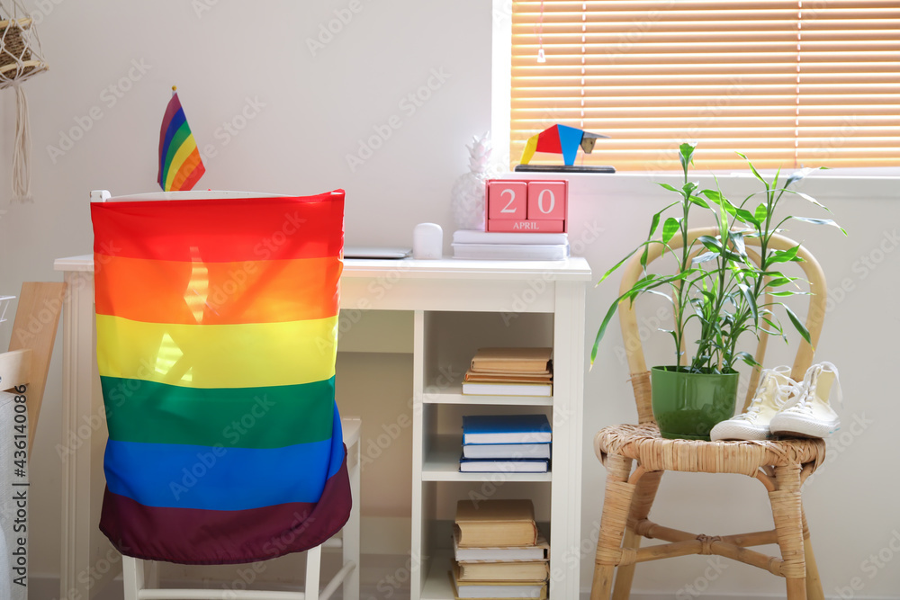 Table with flags of LGBT in interior of room