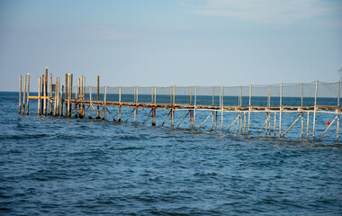 Wall Mural - the waves of the sea on the old jetty