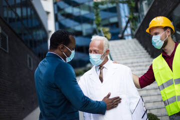 Wall Mural - Business man, doctor and engineer talking on street.