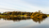 Fototapeta Paryż - Reflection on the River Dee from Lamb Island on Threave Estate, Scotland