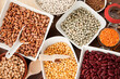 © eyewave - Variety of legumes like lentils, peas, chick peas and beans in bowls, high angle view