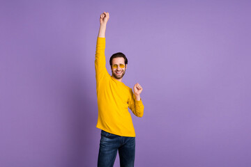 Sticker - Portrait of attractive cheerful dreamy funky man dancing having fun relax isolated over pastel violet purple color background