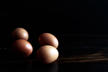 Wall Mural - Chicken Brown eggs on a wooden rustic background