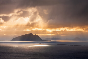 Canvas Print - Sunbeams over an island on the sea