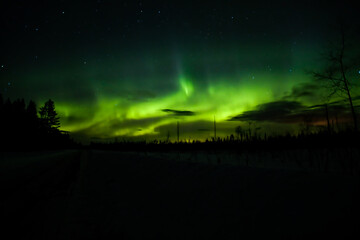 Wall Mural - northern lights and clouds in northern sweden