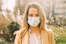 Portrait Of Young Woman Wearing Protective Face Mask
