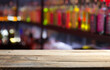 © kishivan - Classic bar counter with bottles in blurred background