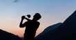 © vectorfusionart - Composition of silhouette of male golf player over landscape and blue sky with copy space