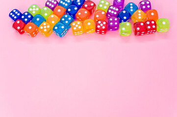 Sticker - Closeup shot of colorful dices on pink background