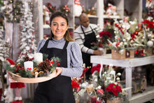 Smiling Flower Shop Worker Making Christmas Compositions