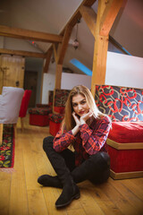 Vertical shot of a young attractive female posing in a casual outfit