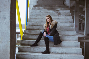 Sticker - Scenic view of a white Caucasian woman wearing a black jacket and posing for a picture