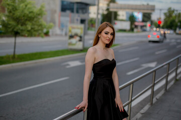 Sticker - Young blonde female posing in an elegant black strapless dress