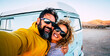 © simona - Happy adult couple smile and have fun together taking selfie picture with old vintage classic van in background - concept of vanlife and travel people - changing life man and woman