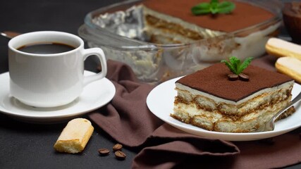 Wall Mural - Portion of Traditional Italian Tiramisu dessert, cup of espresso and baking dish