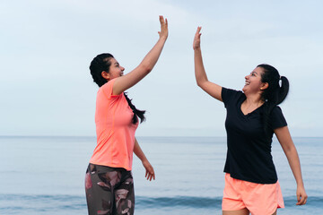 Women high fiving after a run