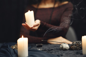 Portrait of fortune-teller in a dark room