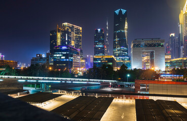 Wall Mural - Dubai, UAE - 05.28.2021 Shot of a Dubai International Financial center at night. Modern architecture