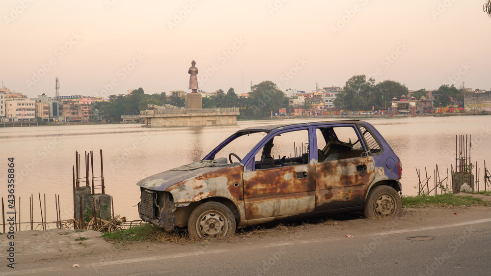 An abandoned car parked at the side of the road Stock Photo | Adobe Stock