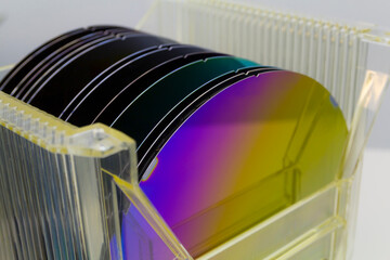 Poster - Silicon Wafers in plastic storage box in clear room of semiconductor foundry.