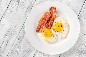 Canvas Print - Fried eggs with bacon rashers