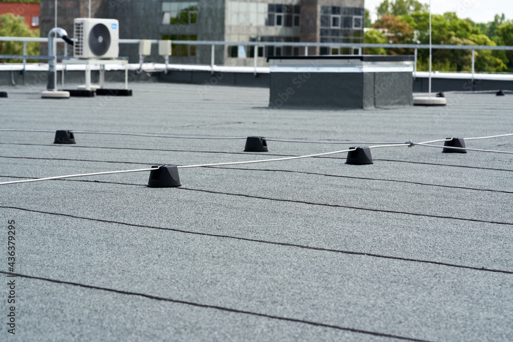 Flat roof protective covering with bitumen membrane for waterproofing - obrazy, fototapety, plakaty 