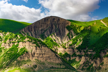 Wall Mural - Green mountains and blue clouds landscape