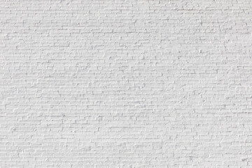  old  brick wall painted in white