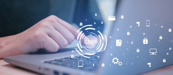 close up man using laptop at home office with virtual interface of GDPR (General Data Protection Regulation ) , privacy personal data concept	