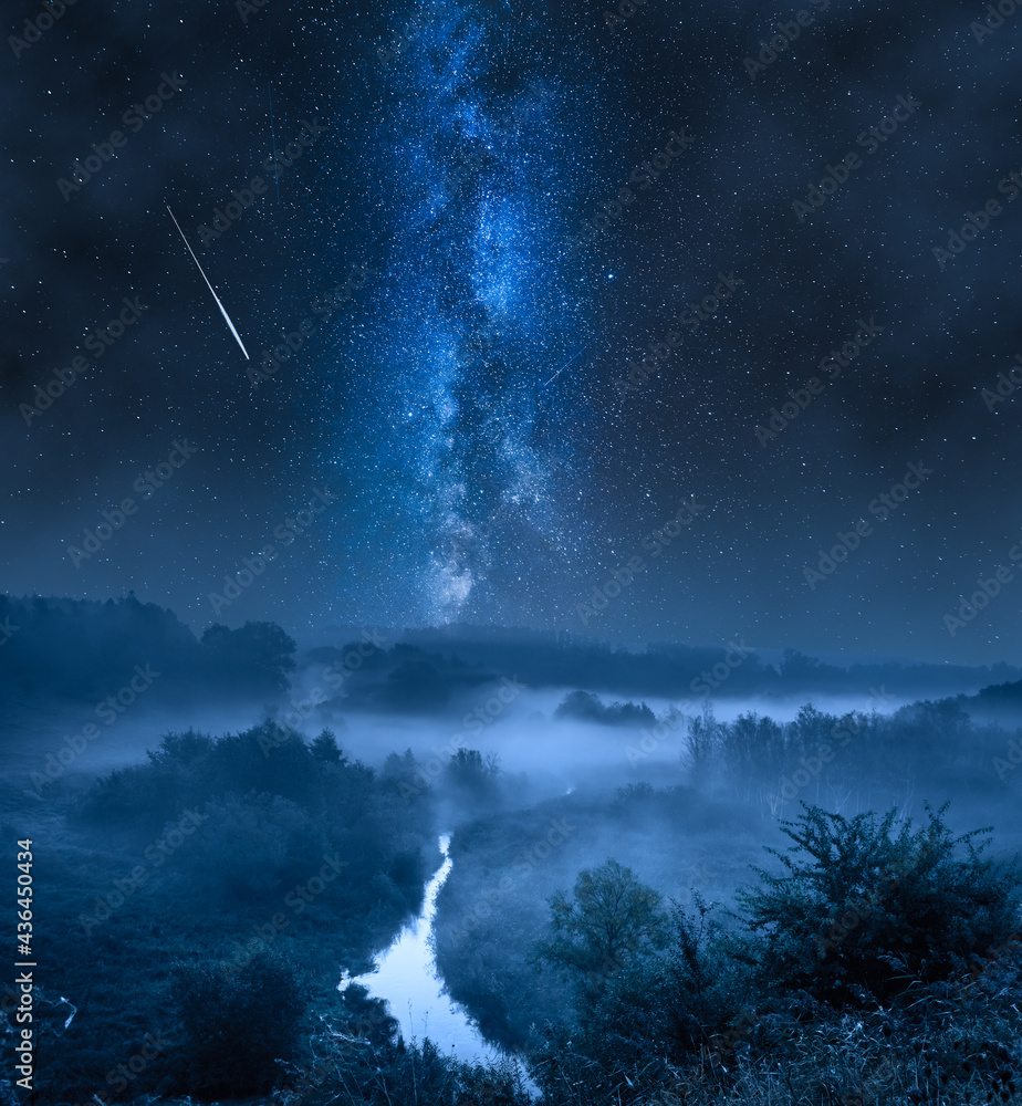 Foggy valley at night with milky way and stars. - obrazy, fototapety, plakaty 