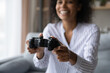 © fizkes - Crop close up of smiling African American woman hold gamepad controller play computer video games at home. Overjoyed millennial female gamer use joypad engaged in electronic entertainment app.