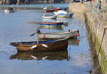 Picturesque Small Boats Moored Along The Quayside At Fishguard, Pembrokeshire, Wales, UK.