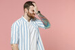 Young ashamed caucasian unshaven man 20s wear blue striped shirt put hand on face facepalm epic fail mistaken omg gesture isolated on pastel pink background studio portrait. People lifestyle concept.