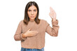 © Krakenimages.com - Young beautiful woman wearing casual clothes swearing with hand on chest and open palm, making a loyalty promise oath