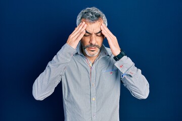 Poster - Handsome middle age man with grey hair wearing business shirt with hand on head for pain in head because stress. suffering migraine.