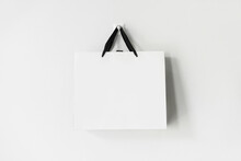 White Paper Shopping Bag On White Background With Copy Space
