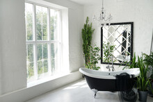 Luxury Bathroom With Big Mirror And Green Plants In Old House