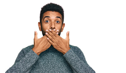 Wall Mural - Young african american man wearing casual clothes shocked covering mouth with hands for mistake. secret concept.