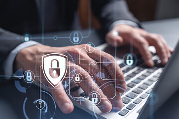 a programmer is typing a code on computer to protect a cyber security from hacker attacks and save c