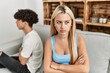 © Krakenimages.com - Young couple angry sitting on the sofa in silence at home.