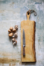 Cutting Board With Mushrooms And Knife
