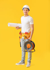 Sticker - Young electrician with tools on color background