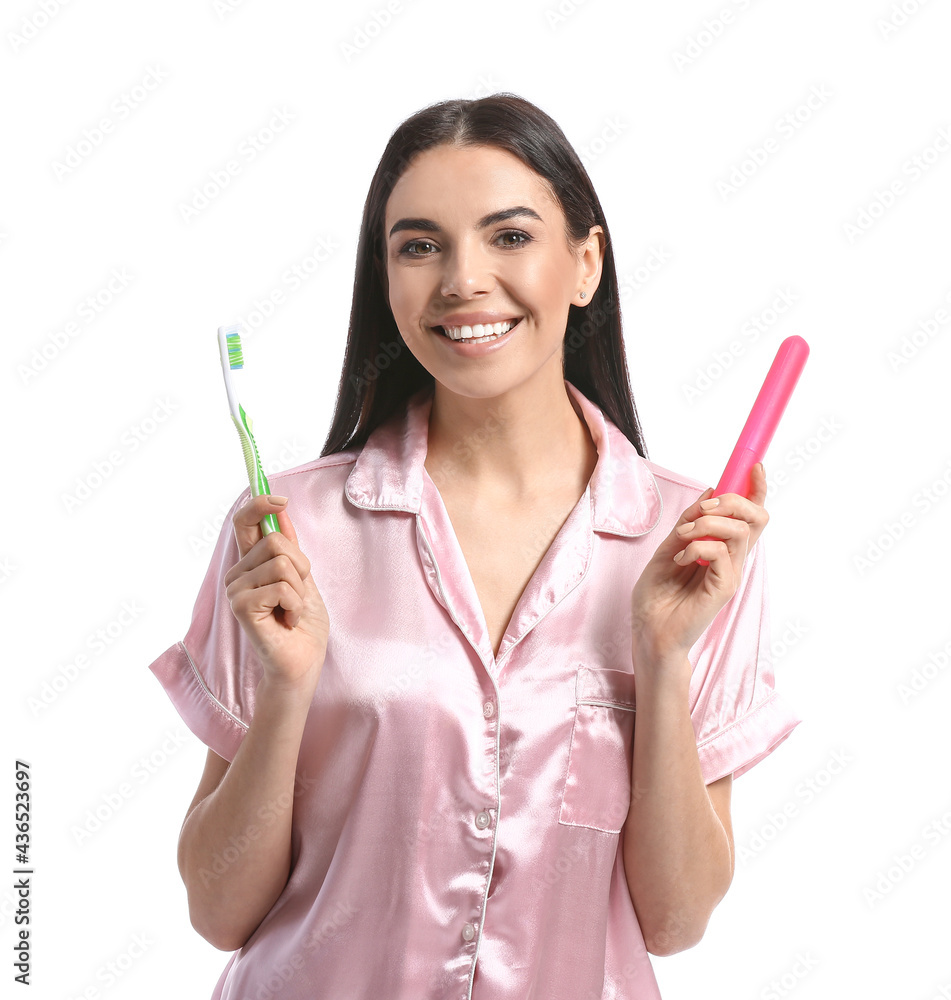 Beautiful woman with tooth brush and case on white background