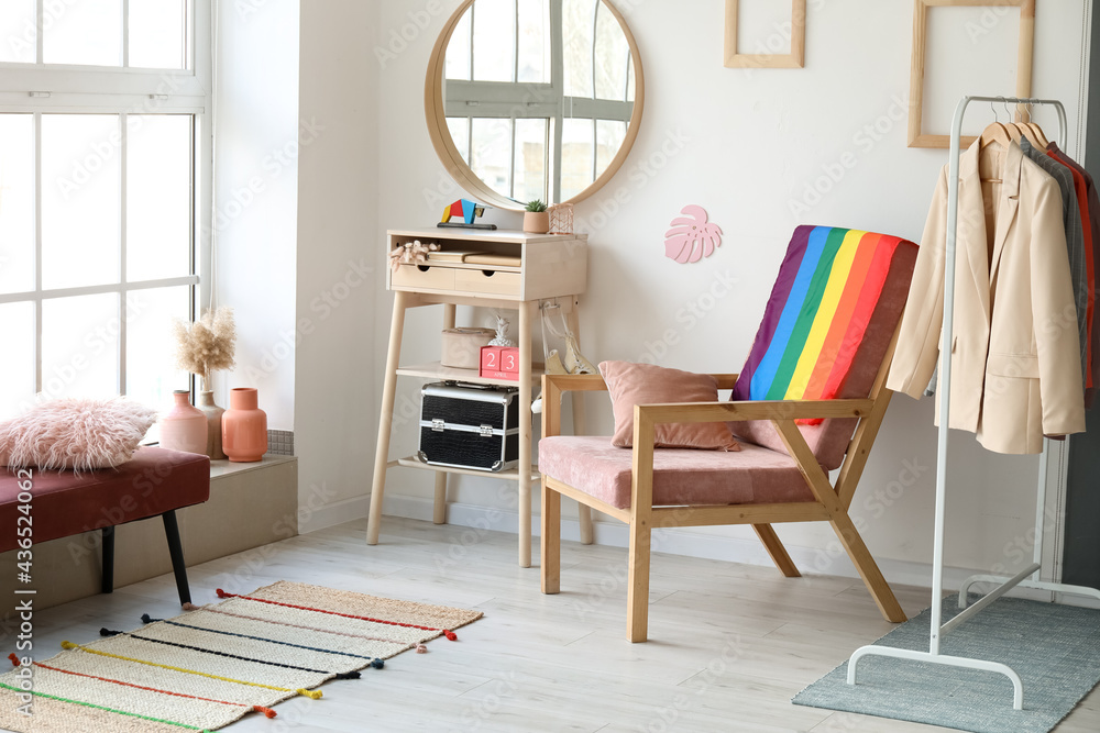 Armchair with flag of LGBT in interior of dressing room - obrazy, fototapety, plakaty 