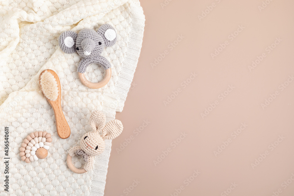 Eco fiendly organic baby rattle and teethers. Sustainable, developmental, sensory toys for newborns. Top view, flat lay, copy space - obrazy, fototapety, plakaty 